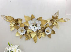 Gold floral metal wall art displayed in luxury modern living room
